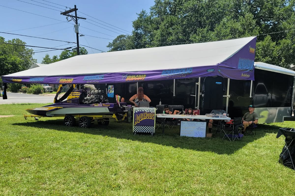 Aquaholic drag boat trailer awning with purple printed graphics
