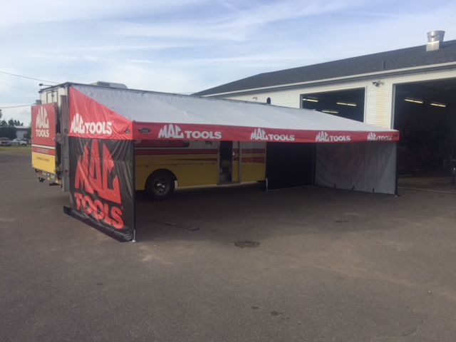 Hospitality trailer awning built by DMP Awnings for race-team entertaining