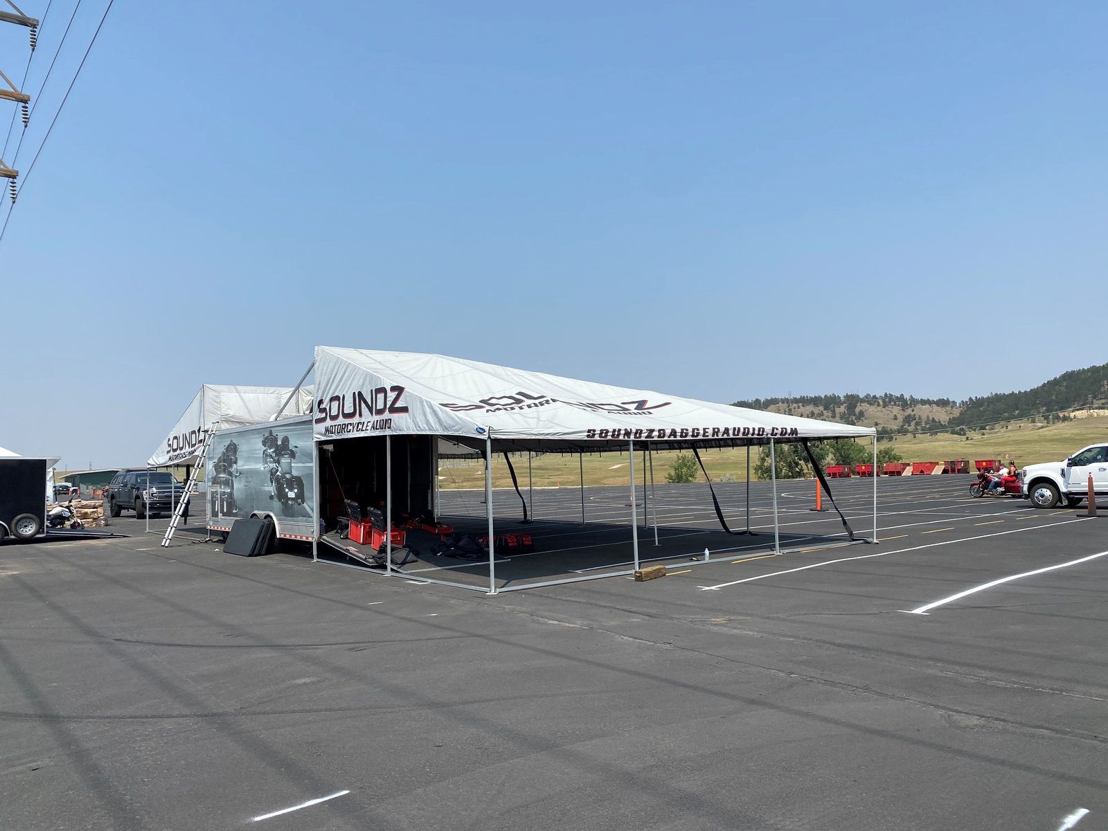 Custom printed powersports vendor trailer awning built by DMP Awnings for Soundz motorcycle audio