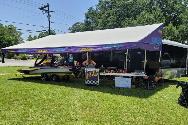 Aquaholic drag boat trailer awning with purple printed graphics