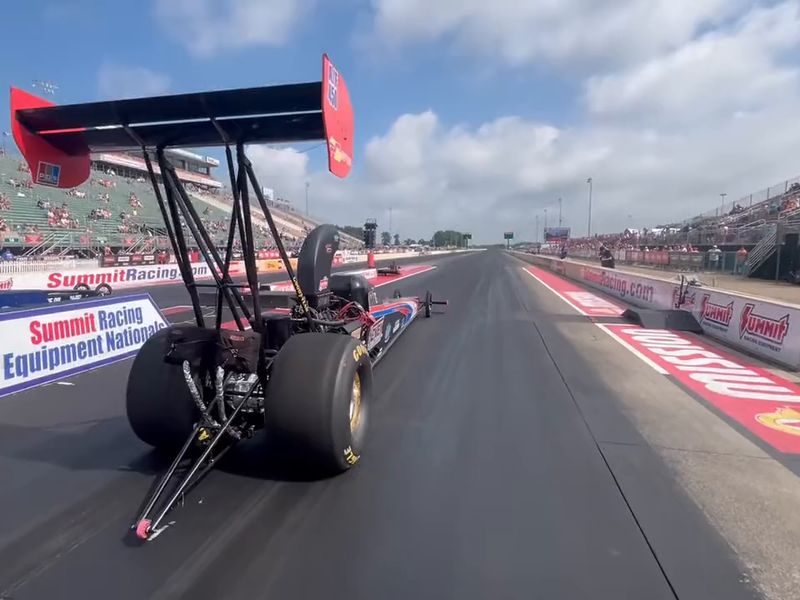 View from behind the DMP Racing dragster's wing as it launches at the Summit Racing Equipment NHRA Nationals in Norwalk