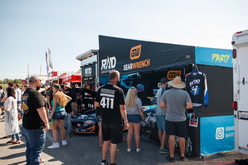 GEARWRENCH and RAD Industries awning drawing a crowd at a race event