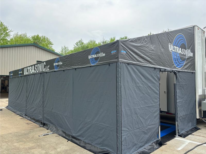 Full enclosure awning on Phil Esz's Top Alcohol Funny Car trailer, closed against wind and weather