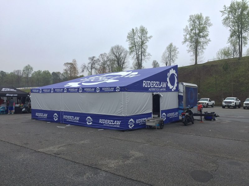 DMP race trailer awning deployed trackside during an event