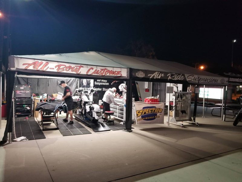 All-Bout Customz race trailer awning lit at night with printed graphics