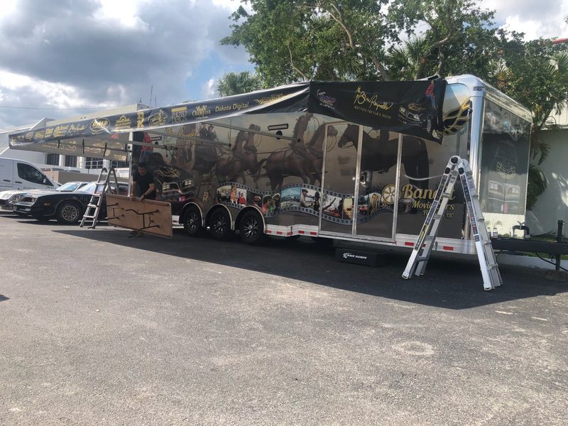 Race trailer awning being set up in the pits
